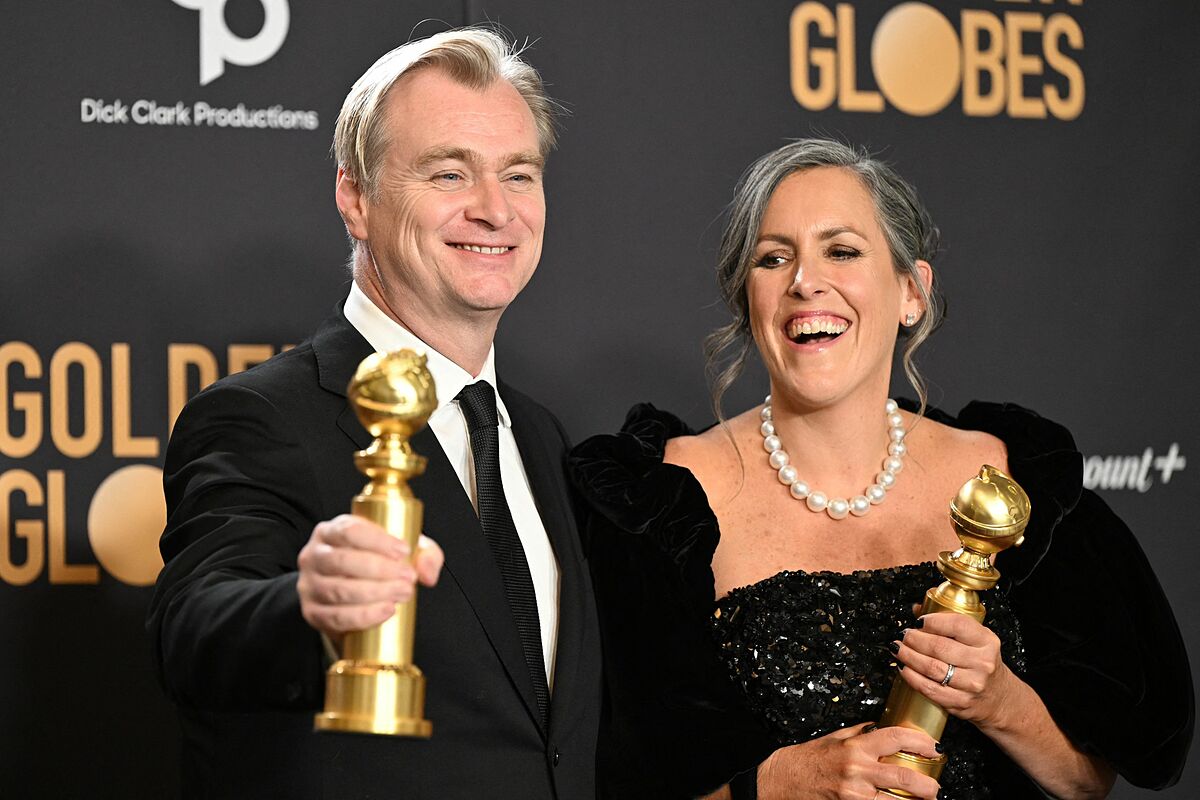 Christopher Nolan (trái) và vợ - nhà sản xuất Emma Thomas - ở lễ trao giải Quả Cầu Vàng 2024. Ảnh: AFP