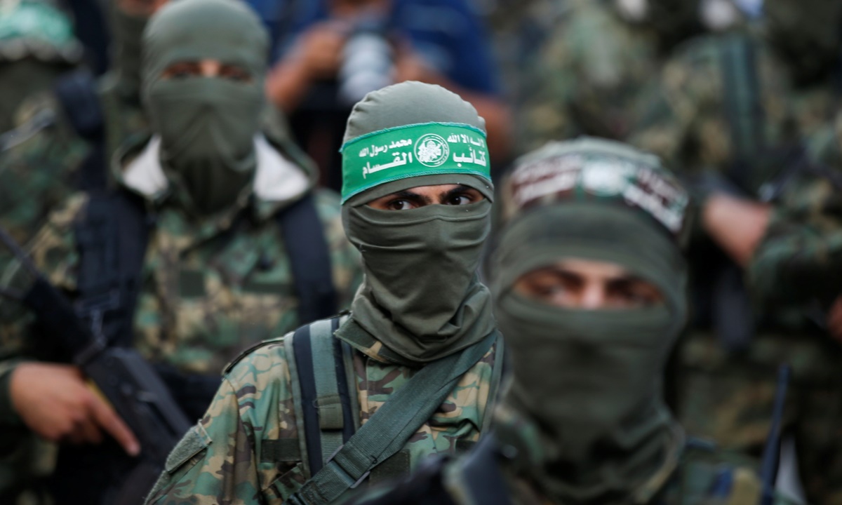 Các tay súng Hamas tham gia một cuộc diễu hành phản đối Israel ở Gaza City hồi tháng 5/2021. Ảnh: Reuters